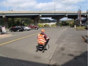 Joseph Luciano feels forced to ride his wheelchair on the streets due to the inaccessibility of the sidewalks in the town where he lives.